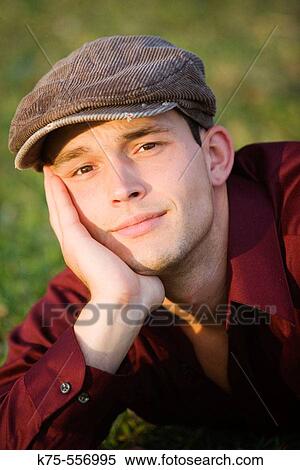 Portrait of a young man outdoors View Large Photo Image Stock Photography - Portrait of a young man outdoors. Fotosearch