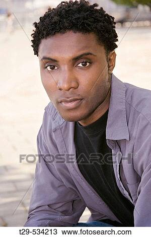 Portrait of a young man View Large Photo Image Stock Image - Portrait of a young man. Fotosearch