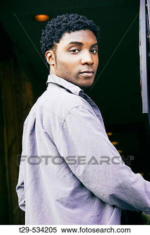 Portrait of a young man View Large Photo Image Stock Photography - Portrait of a young man. Fotosearch