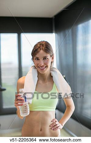 Portrait of a young pretty woman in fitness center View Large Photo Image Picture - Portrait of a young pretty woman in fitness center. Fotosearch