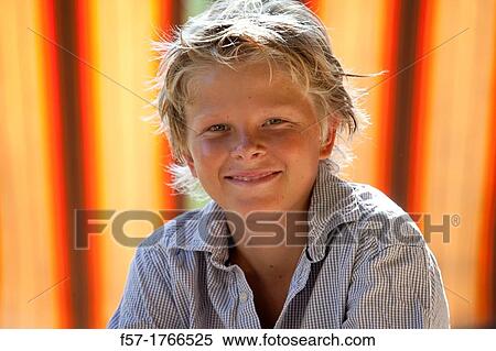 Stock Photography - Portrait of a young teenage boy. Fotosearch