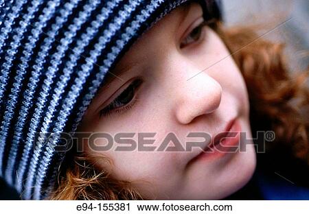 Portrait of a young teenage girl wearing a winter hat, eyes away from camera View Large Photo Image Stock Image - Portrait of a young teenage girl wearing a winter hat, eyes away from camera. Fotosearch