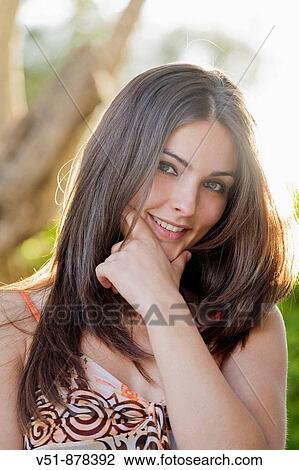 Portrait of a young woma looking at camera View Large Photo Image Stock Image - Portrait of a young woma looking at camera. Fotosearch