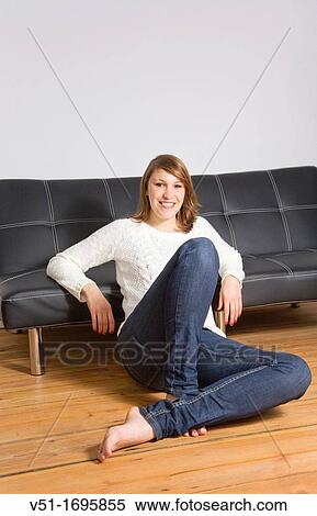 Portrait of a young woman at home View Large Photo Image Stock Photography - Portrait of a young woman at home. Fotosearch