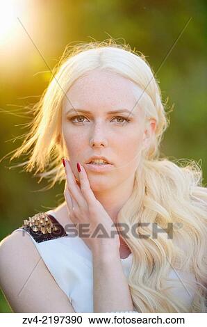 Portrait of a young woman at sunset. View Large Photo Image Stock Image - Portrait of a young woman at sunset.. Fotosearch