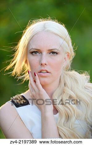 Portrait of a young woman at sunset. View Large Photo Image Stock Photo - Portrait of a young woman at sunset.. Fotosearch
