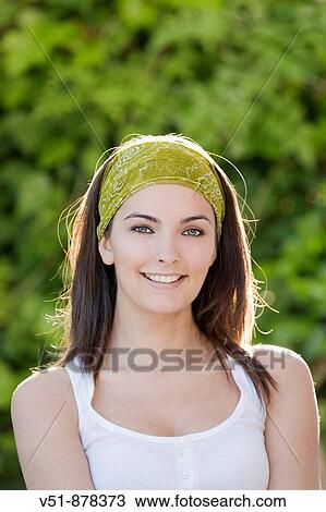 Portrait of a young woman looking at camera View Large Photo Image Stock Image - Portrait of a young woman looking at camera. Fotosearch