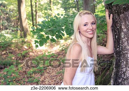 portrait of a young woman portrait in the forest near Coburg, Germany. View Large Photo Image Stock Photograph - portrait of a young woman portrait in the forest near Coburg, Germany.. Fotosearch