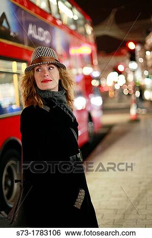 Portrait of a young woman smiling, Regent Street, London, England View Large Photo Image Stock Photograph - Portrait of a young woman smiling, Regent Street, London, England. Fotosearch