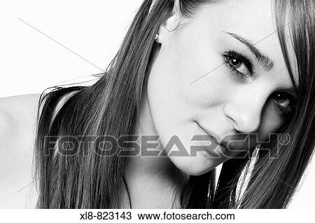 Stock Image - portrait of a young woman, studio. Fotosearch