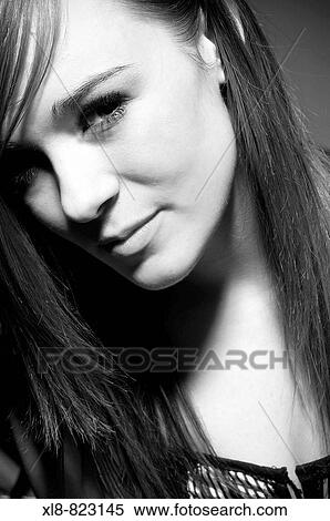 Stock Photography - portrait of a young woman, studio. Fotosearch