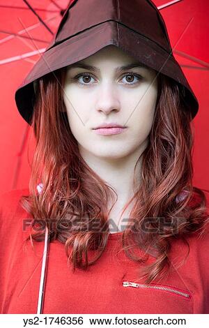 Portrait of a young woman wearing a southwester View Large Photo Image Stock Photograph - Portrait of a young woman wearing a southwester. Fotosearch