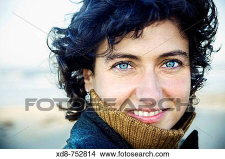 Portrait of a young woman with blue eyes smiling View Large Photo Image Picture - Portrait of a young woman with blue eyes smiling. Fotosearch