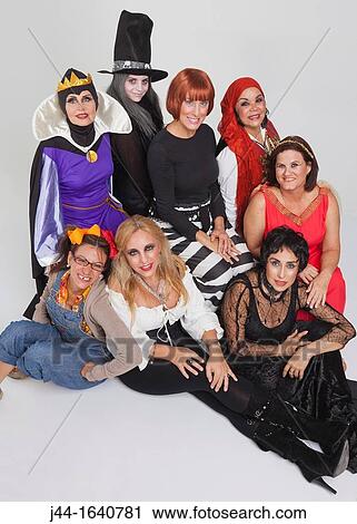 Stock Image - Portrait of adult women wearing costumes. Fotosearch