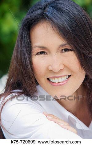 Stock Photo - portrait of an American Asian woman. Fotosearch