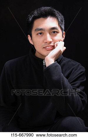 Portrait of an asian young man View Large Photo Image Stock Image - Portrait of an asian young man. Fotosearch