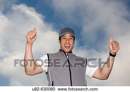 Stock Image - Portrait of an athletic young Asian man.. Fotosearch