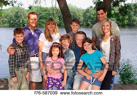 Portrait of an extended family on the banks of the Charles River, Cambridge, Massachusetts. USA. View Large Photo Image Stock Photo - Portrait of an extended family on the banks of the Charles River, Cambridge, Massachusetts. USA.. Fotosearch