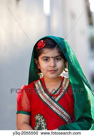 Portrait of an indian american girl playing outdoors. View Large Photo Image Stock Image - Portrait of an indian american girl playing outdoors.. Fotosearch