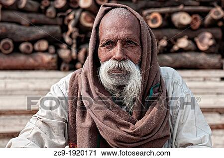 Stock Image - Portrait of an indian man on the ghats. Varanasi, Benares, Uttar Pradesh, India. Fotosearch