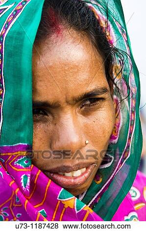 Portrait of an Indian woman wearing a colorful sari. View Large Photo Image Stock Photo - Portrait of an Indian woman wearing a colorful sari.. Fotosearch