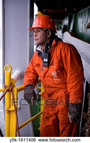 Portrait of an Indonesian seaman or sailor on the container-vessel MV Flintercape, during a journey from Rotterdam, Netherlands, to Sundsvall, Sweden. The man is an? Able Seaman?, who generally works on deck. View Large Photo Image Stock Photograph - Portrait of an Indonesian seaman or sailor on the container-vessel MV Flintercape, during a journey from Rotterdam, Netherlands, to Sundsvall, Sweden. The man is an? Able Seaman?, who generally works on deck.. Fotosearch