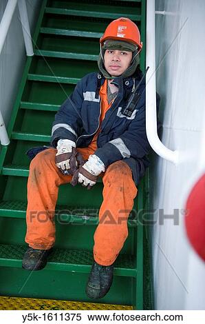 Portrait of an Indonesian seaman or sailor on the container-vessel MV Flintercape, during a journey from Rotterdam, Netherlands, to Sundsvall, Sweden. The man is an? Able Seaman?, who generally works on deck. View Large Photo Image Stock Photography - Portrait of an Indonesian seaman or sailor on the container-vessel MV Flintercape, during a journey from Rotterdam, Netherlands, to Sundsvall, Sweden. The man is an? Able Seaman?, who generally works on deck.. Fotosearch