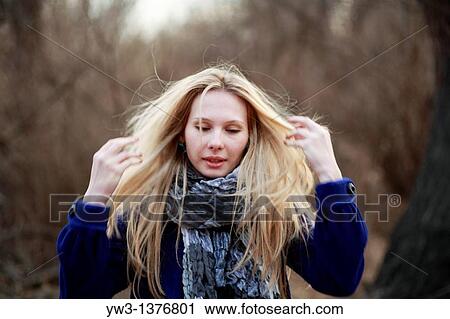 Portrait of beautiful woman in autumn in blue coat View Large Photo Image Stock Image - Portrait of beautiful woman in autumn in blue coat. Fotosearch