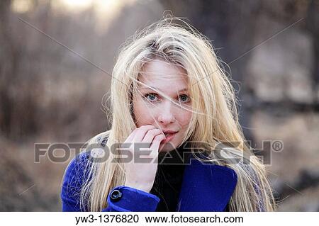 Portrait of beautiful woman in autumn outdoors in blue coat View Large Photo Image Stock Image - Portrait of beautiful woman in autumn outdoors in blue coat. Fotosearch