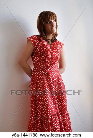 Portrait of beautiful young woman wearing polka dot dress View Large Photo Image Stock Photo - Portrait of beautiful young woman wearing polka dot dress. Fotosearch