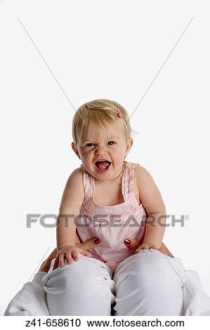 Portrait of blond little girl on her mothers knees View Large Photo Image Stock Image - Portrait of blond little girl on her mothers knees. Fotosearch