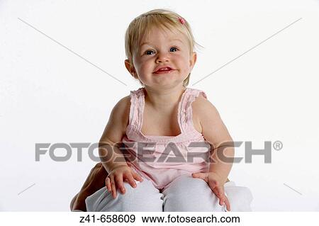 Portrait of blond little girl on her mothers knees View Large Photo Image Stock Photo - Portrait of blond little girl on her mothers knees. Fotosearch