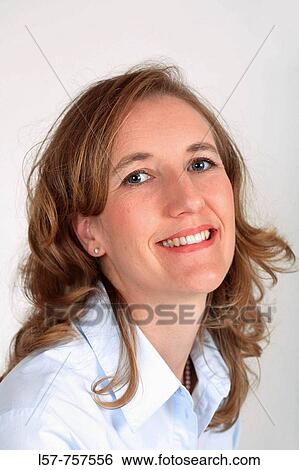 Portrait of blond woman, wearing business blouse, laughing, smiling View Large Photo Image Stock Photograph - Portrait of blond woman, wearing business blouse, laughing, smiling. Fotosearch