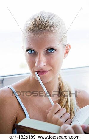 Portrait of blonde woman with green eyes View Large Photo Image Stock Photo - Portrait of blonde woman with green eyes. Fotosearch