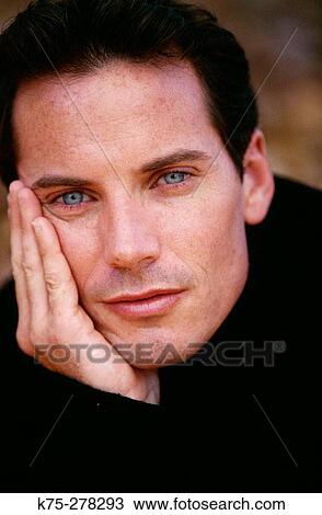 Stock Image - Portrait of blue-eyed male. Fotosearch
