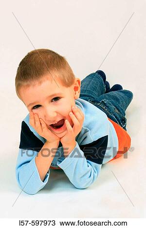 portrait of boy lying on the floor, studio, Oetwil am See, Zuerich, Switzerland View Large Photo Image Stock Image - portrait of boy lying on the floor, studio, Oetwil am See, Zuerich, Switzerland. Fotosearch