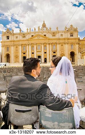 Portrait of bride and groom kissing n front of Saint Peter's square Vatican Rome Italy View Large Photo Image Stock Photo - Portrait of bride and groom kissing n front of Saint Peter's square Vatican Rome Italy. Fotosearch