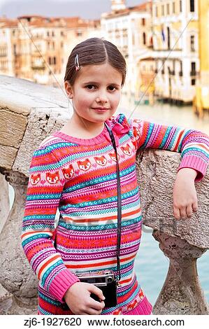 Stock Image - Portrait of brunette girl in Venice. Fotosearch