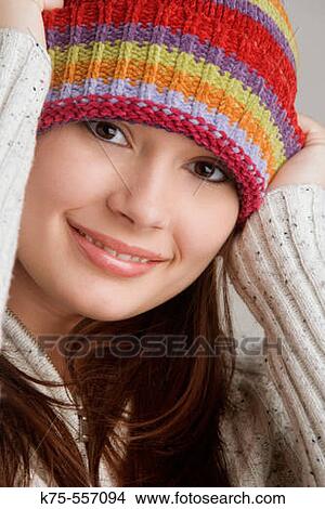 Portrait of caucasian-hispanic woman in her twenties with cap. View Large Photo Image Picture - Portrait of caucasian-hispanic woman in her twenties with cap.. Fotosearch