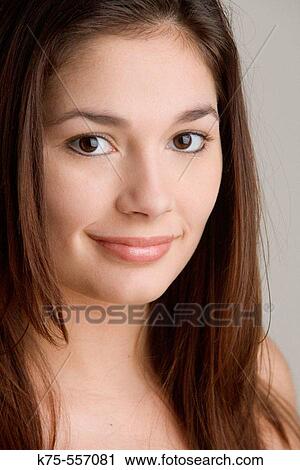 Stock Image - Portrait of caucasian-hispanic woman in her twenties.. Fotosearch
