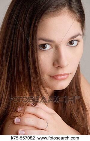 Stock Image - Portrait of caucasian-hispanic woman in her twenties.. Fotosearch