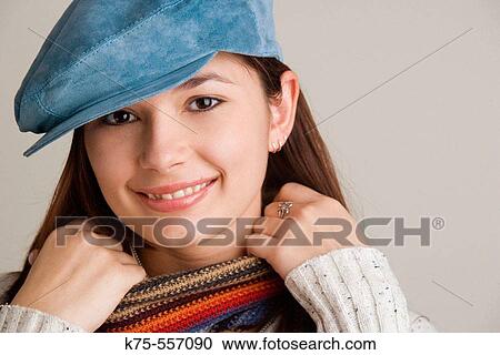 Portrait of caucasian-hispanic woman in her twenties with blue suede cap and scarf, smiling. View Large Photo Image Stock Image - Portrait of caucasian-hispanic woman in her twenties with blue suede cap and scarf, smiling.. Fotosearch