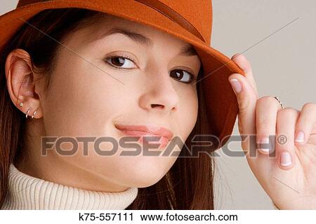 Portrait of caucasian-hispanic woman in her twenties with a hat and a turtleneck. View Large Photo Image Stock Image - Portrait of caucasian-hispanic woman in her twenties with a hat and a turtleneck.. Fotosearch
