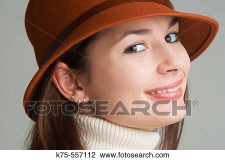 Portrait of caucasian-hispanic woman in her twenties with a hat and a turtleneck. View Large Photo Image Stock Image - Portrait of caucasian-hispanic woman in her twenties with a hat and a turtleneck.. Fotosearch