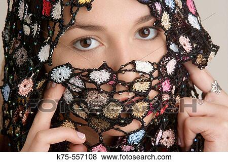 Stock Photo - Portrait of caucasian-hispanic woman in her twenties.. Fotosearch
