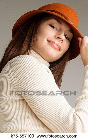Portrait of caucasian-hispanic woman in her twenties with a hat and a turtleneck. View Large Photo Image Stock Photo - Portrait of caucasian-hispanic woman in her twenties with a hat and a turtleneck.. Fotosearch