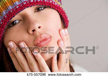 Portrait of caucasian-hispanic woman in her twenties with cap. View Large Photo Image Stock Photograph - Portrait of caucasian-hispanic woman in her twenties with cap.. Fotosearch