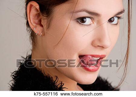 Stock Photograph - Portrait of caucasian-hispanic woman in her twenties.. Fotosearch