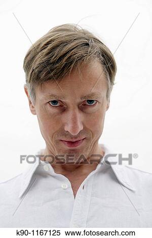 Portrait of caucasian man, putting his heas down, looking at the camera View Large Photo Image Stock Photography - Portrait of caucasian man, putting his heas down, looking at the camera. Fotosearch