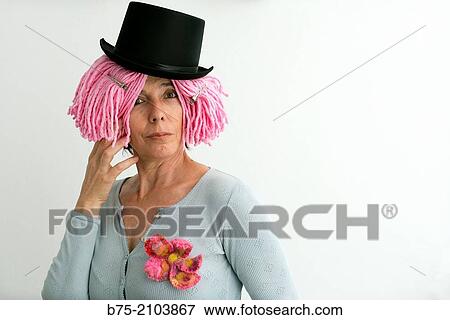 Portrait of Caucasian woman, fifties, pink wig and black hat. View Large Photo Image Stock Photo - Portrait of Caucasian woman, fifties, pink wig and black hat.. Fotosearch